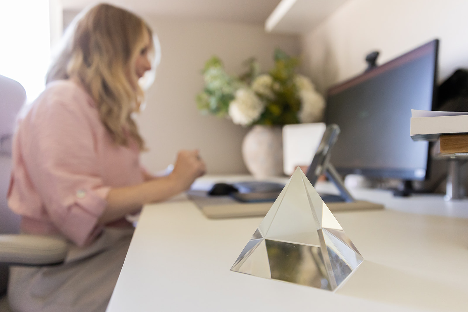A prism on Dr Rachel Megahy's desk, casting refracted light